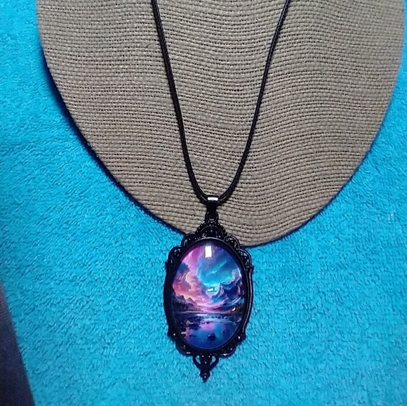 Jewelry - Black cabochon on black cord pink blue aurora mountain scene necklace